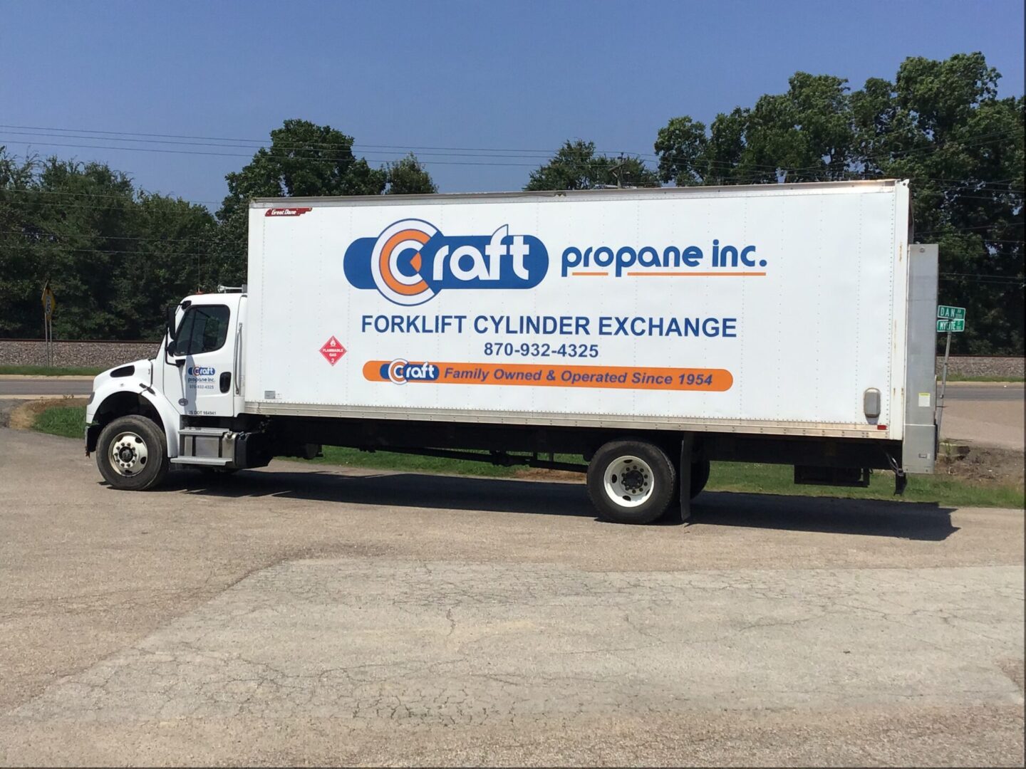 A white truck parked in the parking lot.