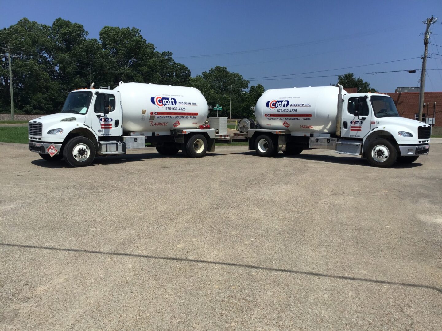 Two cement trucks parked in a parking lot.